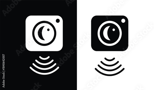 a striking visual juxtaposition presents two identical camera icons one on a white background and the other on black with radiating waves below each
