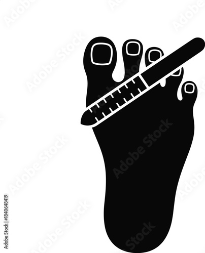 Black silhouette of a foot being filed with a nail file filing