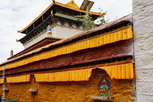 Photos Historic Tradruk Temple in Tsetang, Lhoka, Tibet features traditional Tibetan Buddhist architecture with ochre walls, ornate eaves, and sacred murals, a revered cultural heritage landmark