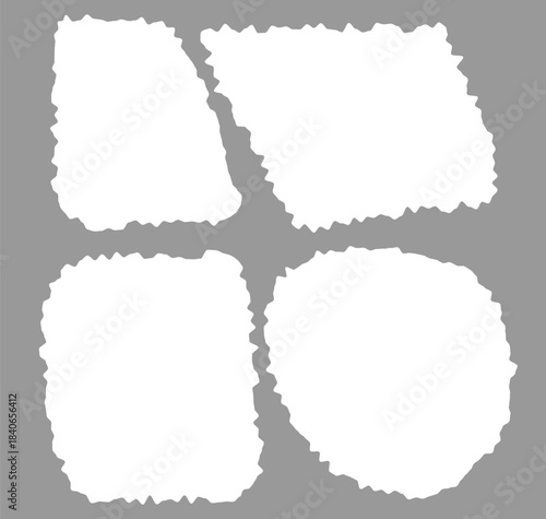 Four white torn paper shapes on gray background for design and layout purposes