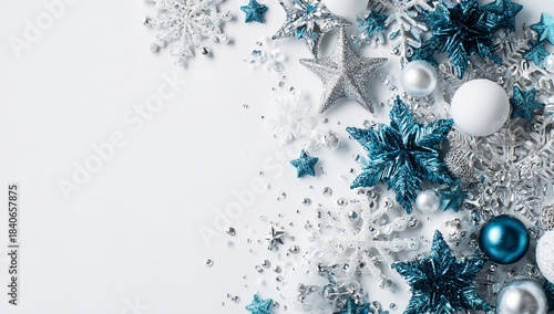 Elegant Holiday Composition Featuring Blue and Silver Ornaments and Snowflakes on White Backdrop