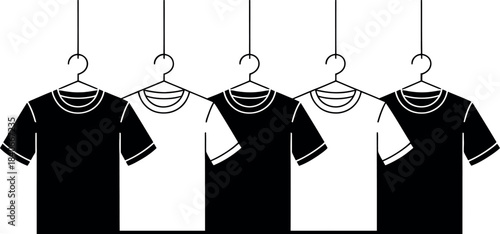 Four TShirts Hanging on Clothes Hangers in a Row
