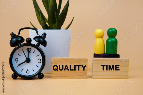 Quality time concept with a clock, wooden figures, and blocks symbolizing spending meaningful moments together, family bonding, relationship care, and time management for personal connection.