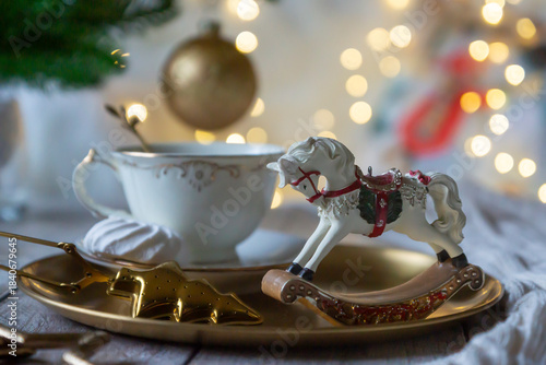 On the table there is New Year's tea 2026, coffee, gingerbread and pine cone cookies.