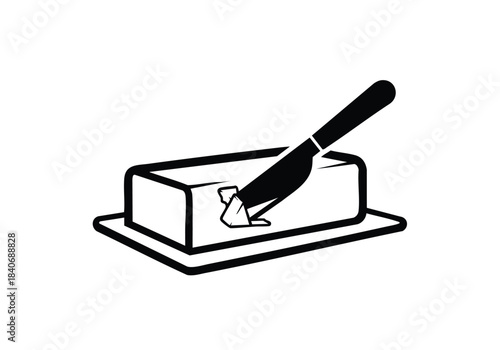Knife cutting cheese on a wooden cutting board