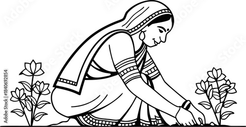 indian traditional woman in saree planting tulsi a