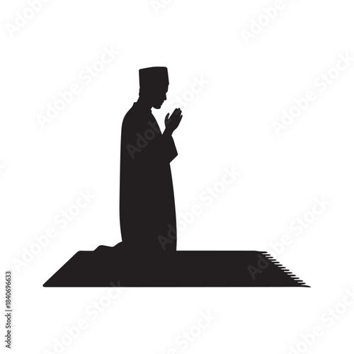 Black Silhouette of Muslim Man Standing and Praying on Mat in Traditional Dress. 