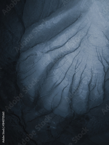 Aerial view of a landscape showing nature's intricate patterns etched into the earth, a symphony of texture and tone unfolds from above, Centuripe, Sicilia, Italy.