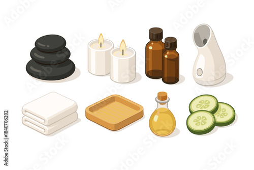 Spa essentials collection with candles, oils, towels, stones, and cucumber slices