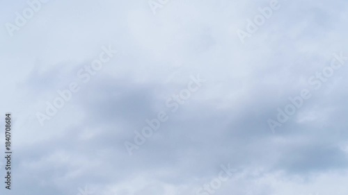 Timelapse of sky with moving white clouds, showcasing the dynamic beauty of nature. Change weather concept. Cloudscape time lapse. Natural background. 4K footage.