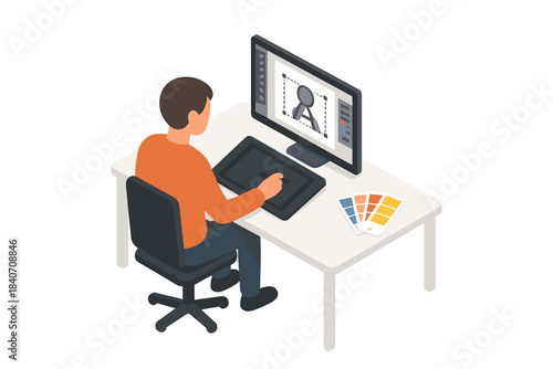 Young caucasian male digital artist designing graphics on tablet and computer