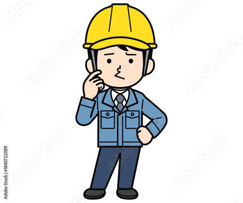 不満顔のヘルメットをかぶった現場監督の男性