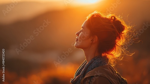 Serene Young Woman Embracing the Sunrise, Experiencing Joy and Gratitude in Nature's Embrace