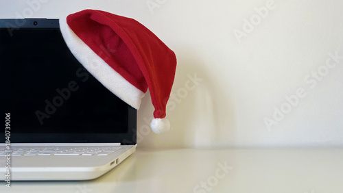 Holiday season laptop with Santa hat