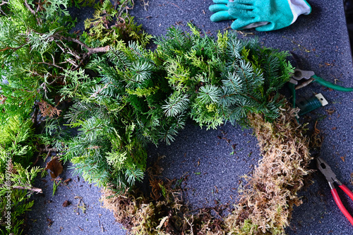 Christmas holiday winter decor, wreath making supplies and outdoor planter displays using natural plants and other organic materials