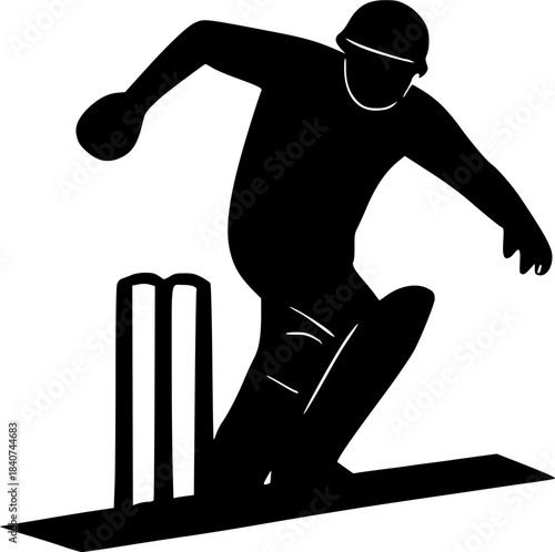Silhouette of a cricket playerplaying near wickets