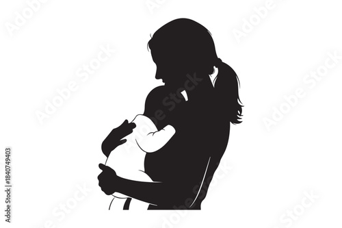 Silhouette of a mother holding her baby close