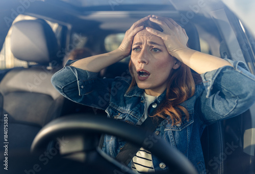 Driver shows concern while inside her vehicle