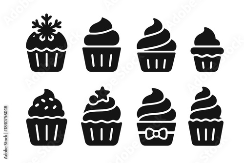 Winter Cupcake Icons. Winter treats. Filled icon set of winter treats: cupcake with snowflake, frosted cupcake