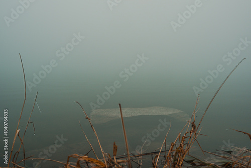 Photography stone by the lake in the mist