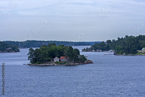 A beautiful landscape of the wide Scandinavian water area with rocky islands. A summer day on the Baltic Sea bay near Stockholm, Sweden.