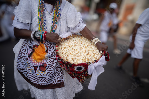 Devotees with Popcorn in a Basket during a Candomble Procession