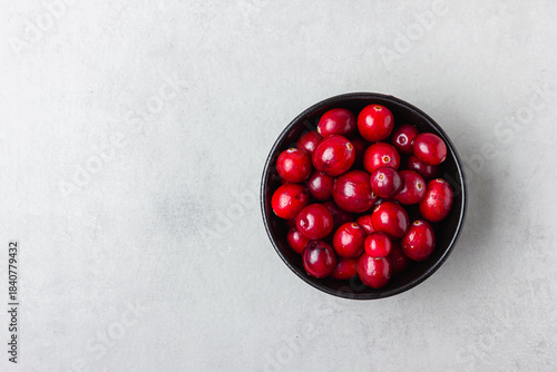 Top view of cranberries in black bowl