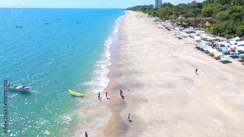 Aerial video taken with a drone on Santa Clara Beach on a sunny day with perfect weather next to the Pacific Ocean, in the province of Coclé, in Río Hato, Panama.	