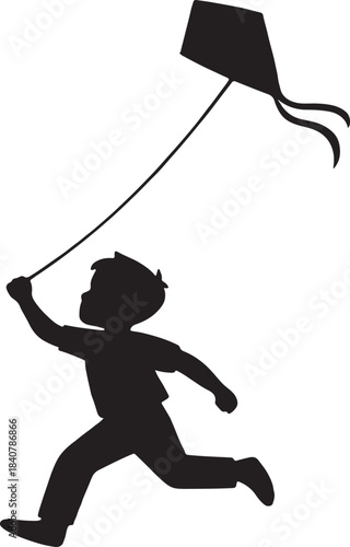 Silhouette of a boy running and flying a kite