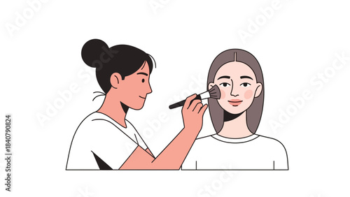 Makeup artist applying blush to a womans cheek
