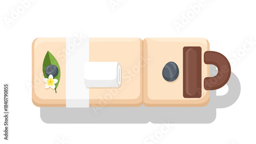 Massage table with rolled towel stones leaf flower and berry