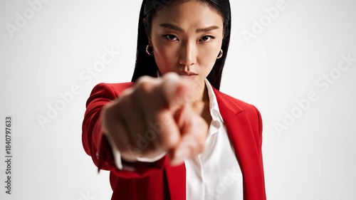 Wallpaper Mural Confident Asian Woman in Red Suit Posing with Determination. Torontodigital.ca