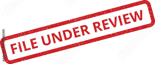 Distressed red rubber stamp marking a document as currently undergoing official review or assessment process