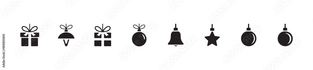 Obraz premium Christmas gifts and ornaments black silhouette icons set isolated on white background for holiday greeting cards