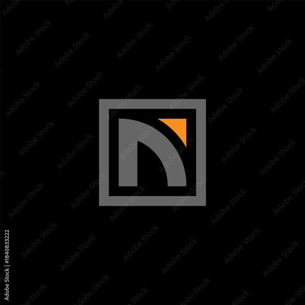 Obraz premium A minimalist grey letter 'n' logo with an orange accent inside a square on a black background.