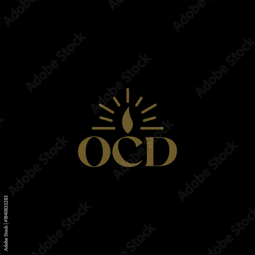 Gold 'OCD' logo with a stylized candle flame and radiating light on a black background, representing a brand or concept.