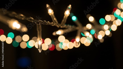 christmas lights on a black background with bokeh defocused lights