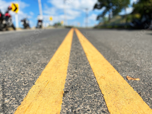 Yellow traffic line color Double solid lines to warn prohibiting overtaking, Yellow continuous tracks of prohibited overtaking painted on the asphalt, Safety driving and traffic regulating rules