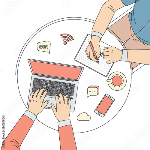 Overhead view of two people working together at a round table with a laptop and coffee.