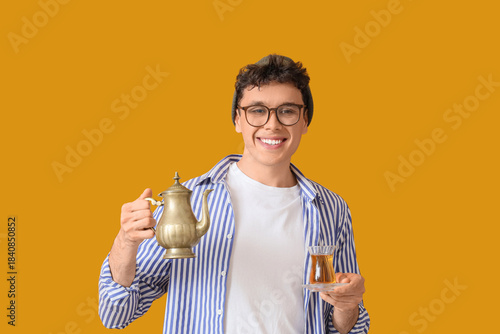 Young man with Turkish tea ...
