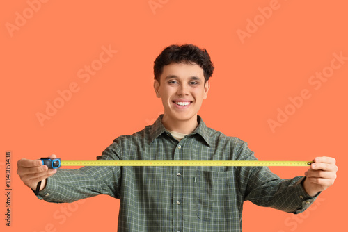 Young man with tape measure...