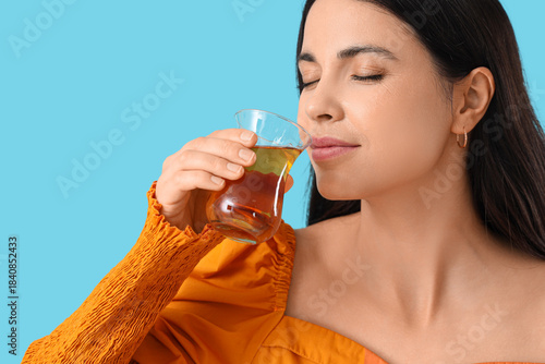 Beautiful woman drinking Tu...