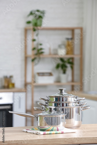 Stainless cooking pots on w...