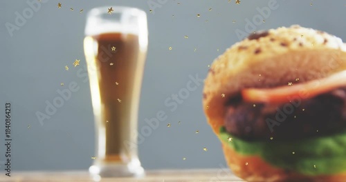 Burger sliding in from right, growing while beer glass blurring, showcasing menu item