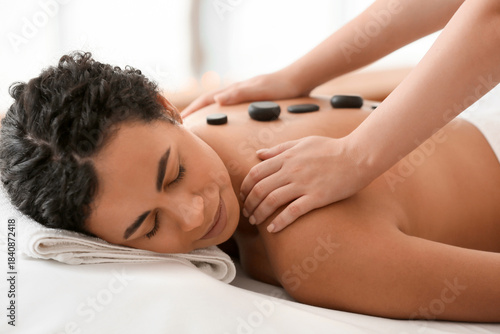 Relaxed woman receiving hot...