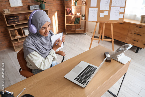 Young Muslim woman with hea...
