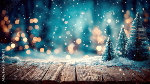 Snowy wooden table with miniature fir trees and glowing bokeh lights in background creating festive winter atmosphere