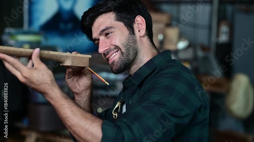 Luthier making top of guitar using traditional tools in workroom with manual tools, arts and craft concept.