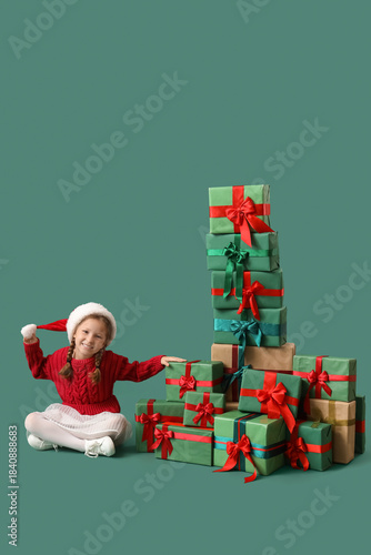 Cute little girl in Santa h...