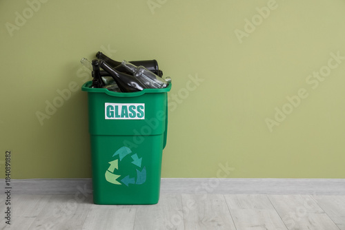 Full trash bin with GLASS s...